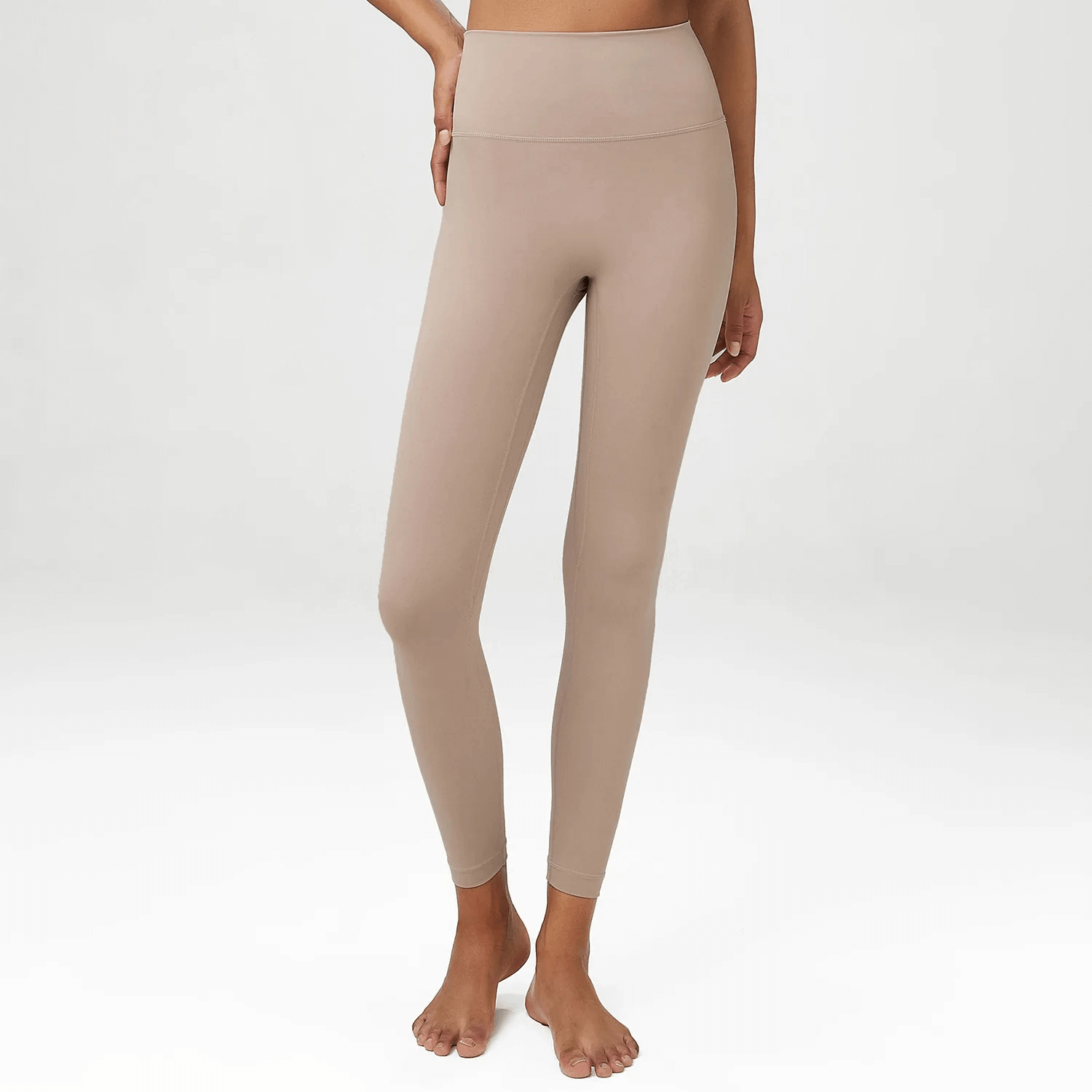 Women's high waist yoga leggings in beige, made from LYCRA for optimal fit, perfect for yoga, gym, or casual wear.